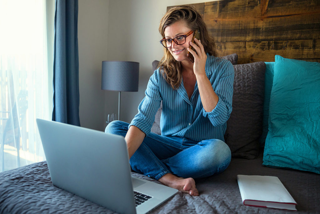 Woman making money in the comfort of her own bed. 